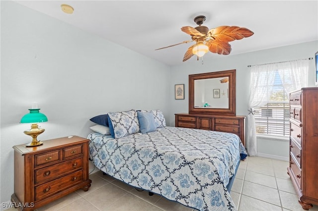 tiled bedroom featuring ceiling fan