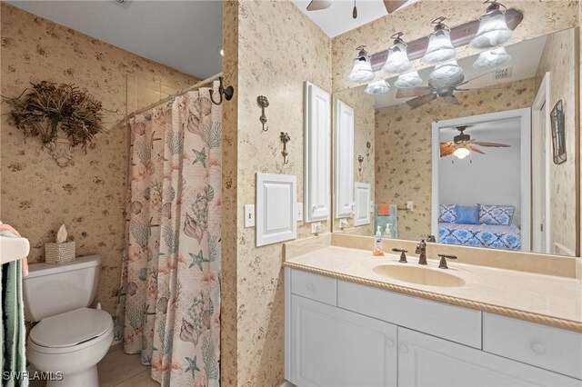 bathroom with vanity, ceiling fan, tile patterned floors, and toilet