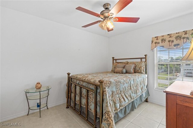 bedroom featuring ceiling fan and light tile patterned floors