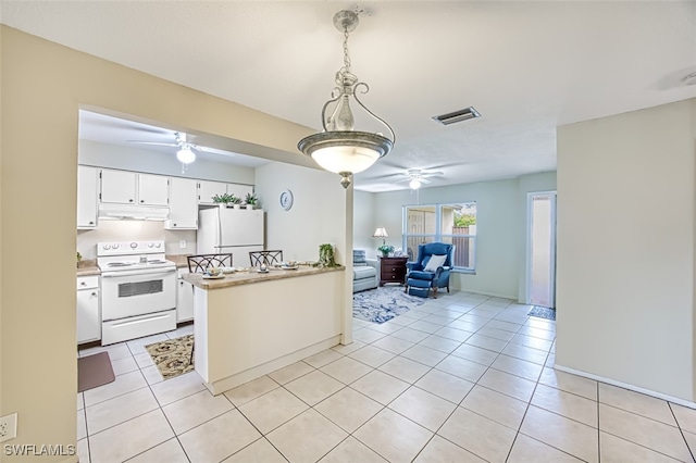 kitchen featuring ceiling fan, light tile patterned floors, white cabinets, and white appliances