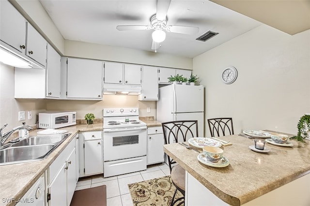 kitchen with sink, white appliances, light tile patterned floors, ceiling fan, and white cabinetry