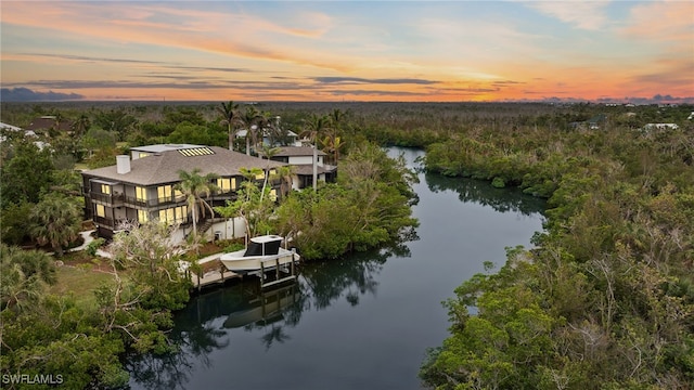 aerial view at dusk with a water view