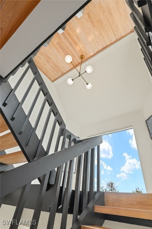 stairs with wooden ceiling