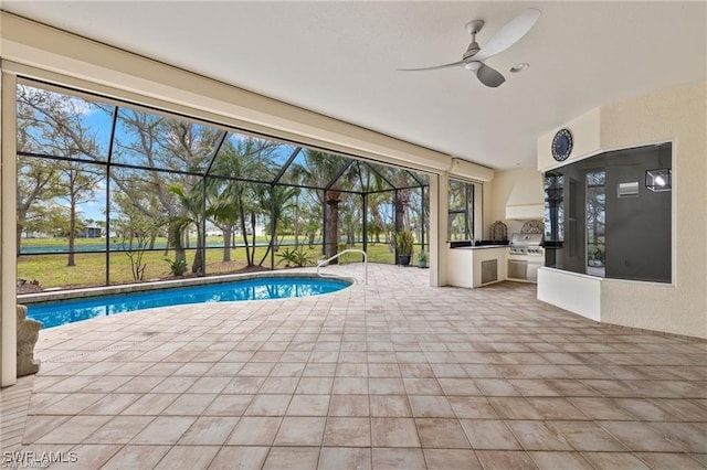 view of pool with a patio, area for grilling, ceiling fan, grilling area, and glass enclosure