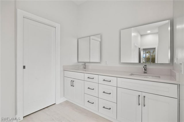 bathroom with tile patterned flooring and vanity