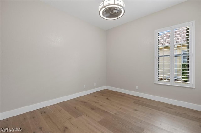 spare room featuring light hardwood / wood-style flooring