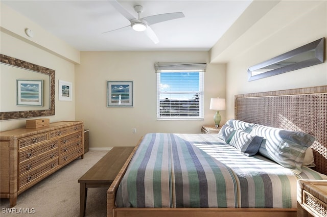 bedroom with light colored carpet and ceiling fan