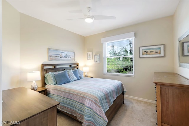 bedroom with light colored carpet and ceiling fan