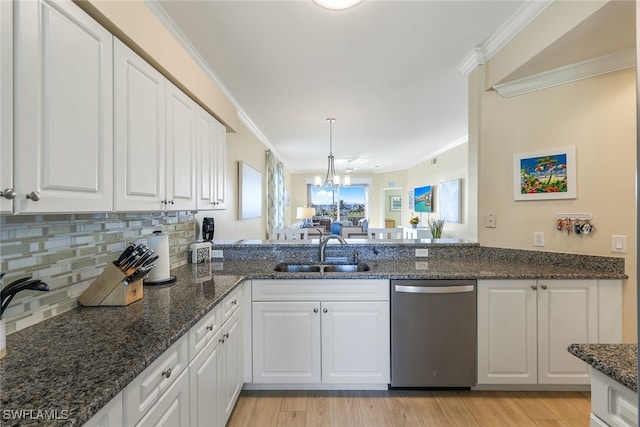 kitchen with dark stone counters, dishwasher, sink, and white cabinets