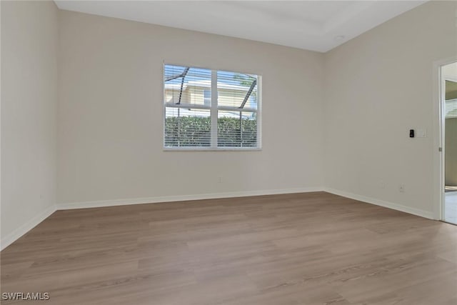 spare room featuring light wood-type flooring