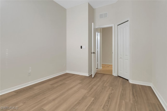 unfurnished room featuring light hardwood / wood-style floors