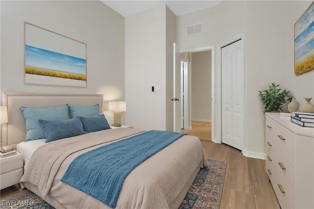 bedroom with hardwood / wood-style floors