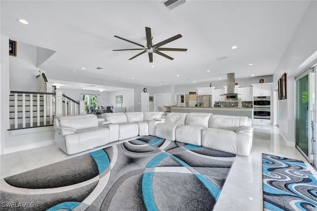 living room with stairs, recessed lighting, visible vents, and ceiling fan