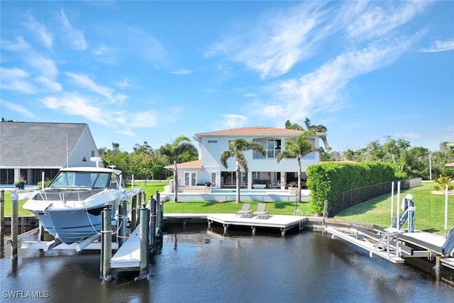 dock area featuring a pool, boat lift, and a water view