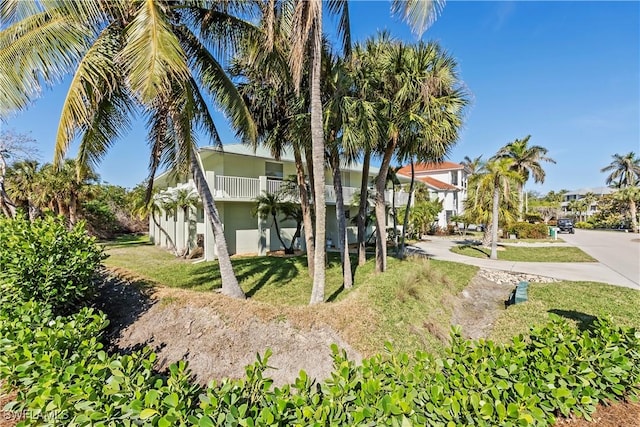 view of front of home featuring a balcony