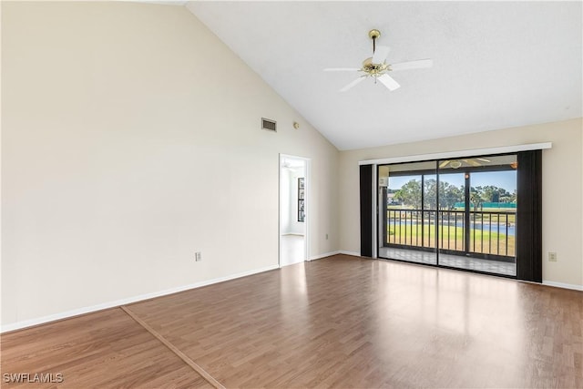 unfurnished room with hardwood / wood-style flooring, high vaulted ceiling, and ceiling fan