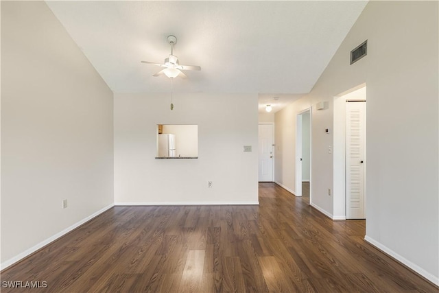 unfurnished living room with lofted ceiling, dark hardwood / wood-style floors, and ceiling fan