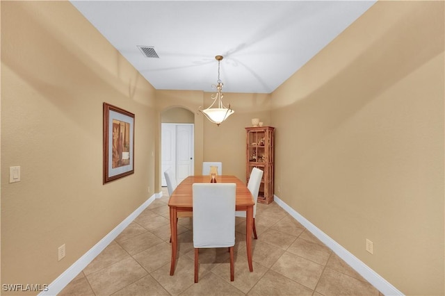 dining area with light tile patterned floors