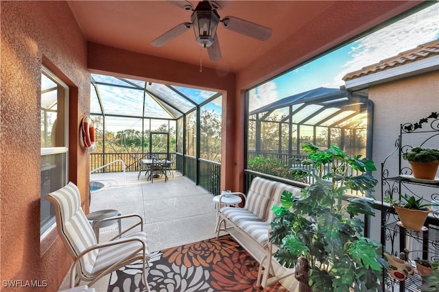 sunroom / solarium with ceiling fan