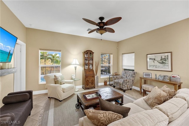 tiled living room featuring ceiling fan