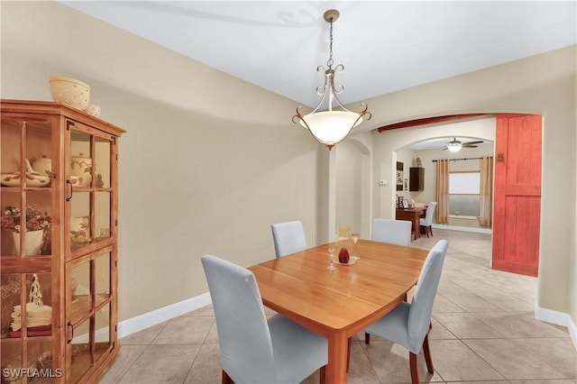 dining room with ceiling fan and light tile patterned floors