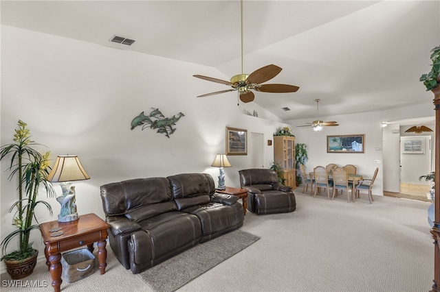 living room with vaulted ceiling, carpet flooring, and ceiling fan