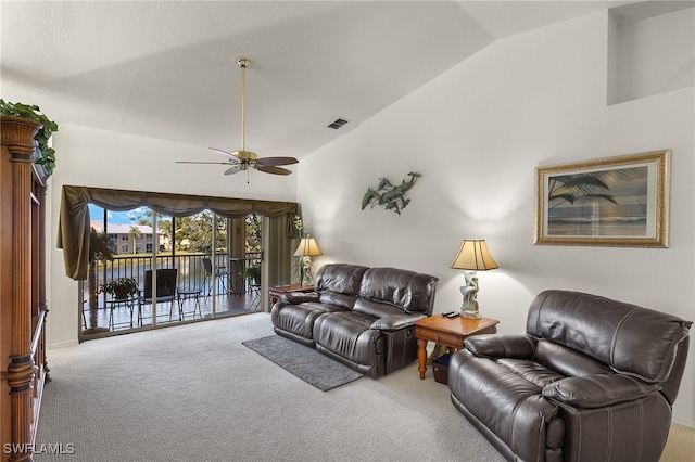 carpeted living room featuring high vaulted ceiling and ceiling fan