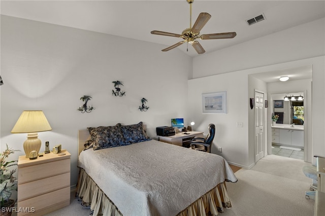 carpeted bedroom featuring ensuite bathroom and ceiling fan