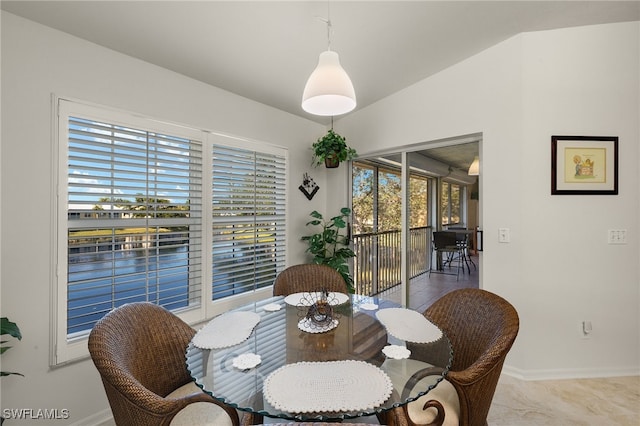 dining area with vaulted ceiling