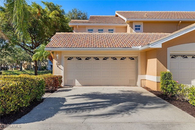 mediterranean / spanish-style home featuring a garage