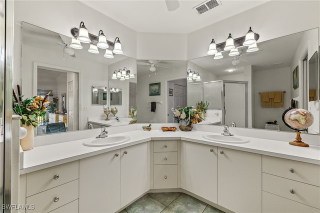 bathroom featuring vanity, tile patterned floors, ceiling fan, and walk in shower