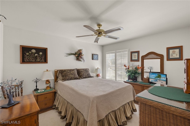 bedroom with ceiling fan and carpet