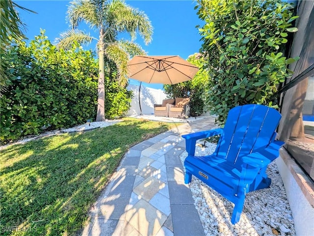 view of patio with an outdoor hangout area and fence