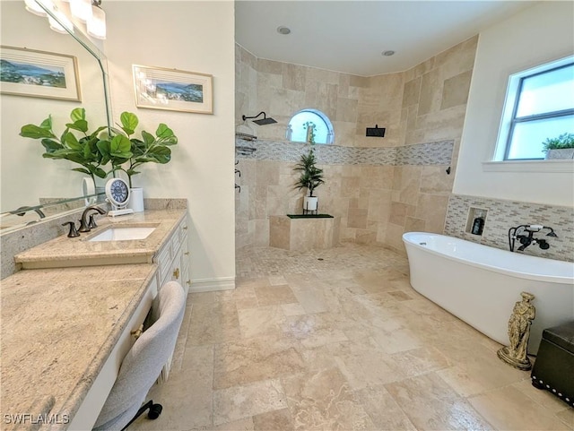 full bath with a soaking tub, walk in shower, and vanity