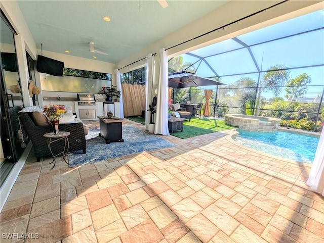 view of patio with an outdoor kitchen, outdoor lounge area, fence, a pool with connected hot tub, and grilling area