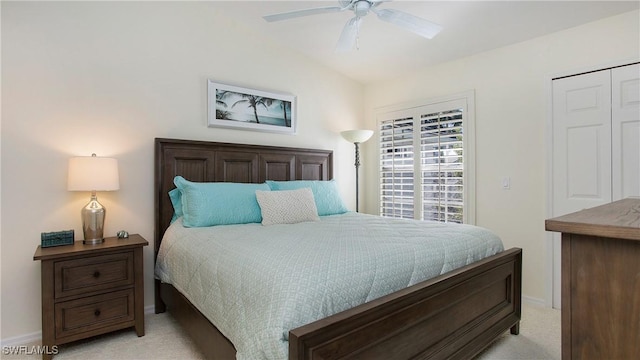 carpeted bedroom featuring ceiling fan and vaulted ceiling