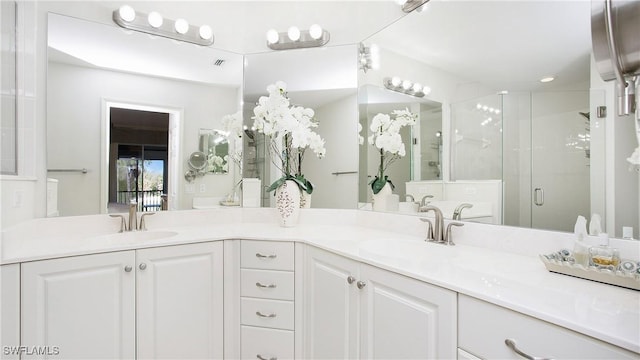 bathroom with vanity and walk in shower