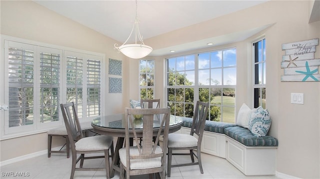 dining space featuring light tile patterned floors