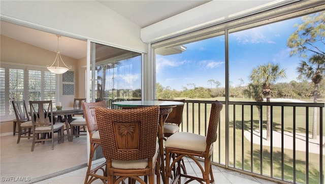 sunroom / solarium with vaulted ceiling