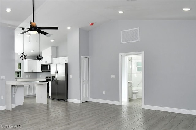 unfurnished living room with ceiling fan, high vaulted ceiling, and light hardwood / wood-style flooring