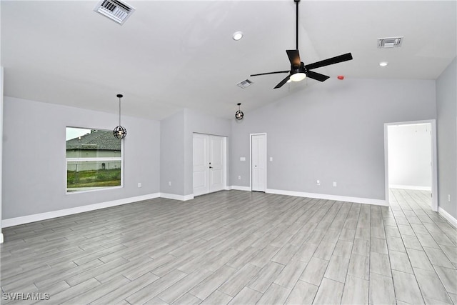 unfurnished living room with high vaulted ceiling, ceiling fan, and light hardwood / wood-style flooring