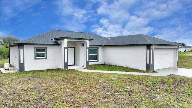 3103 Vera Ave S, Lehigh Acres, FL 33976 - back of property with a garage and a yard