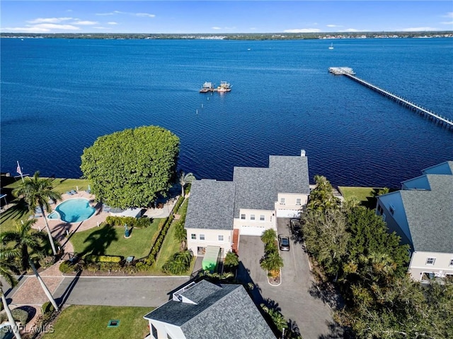 birds eye view of property with a water view