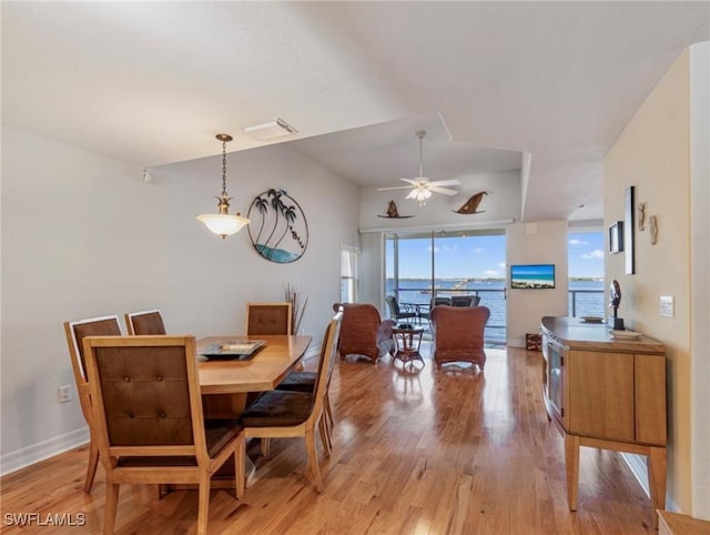 dining area featuring light hardwood / wood-style floors and ceiling fan