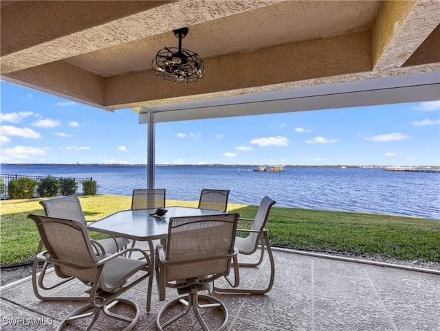 view of patio with a water view