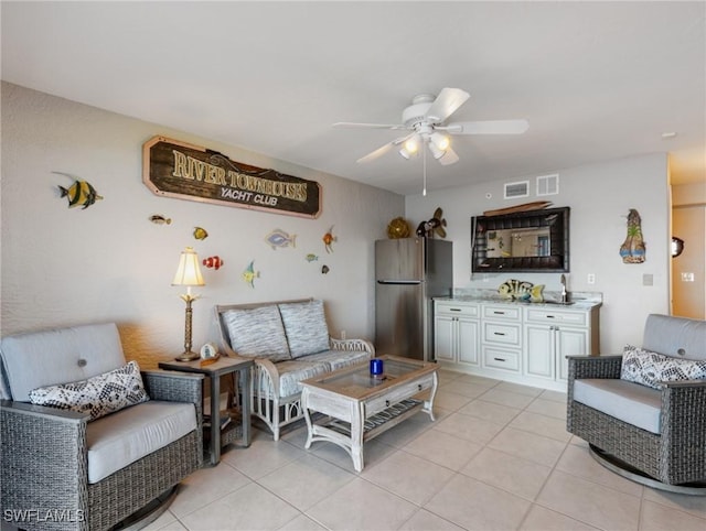 living room with light tile patterned floors and ceiling fan