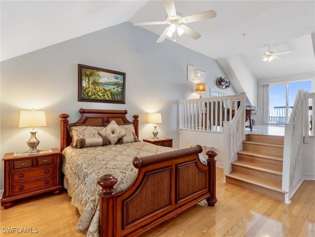 bedroom with light hardwood / wood-style flooring, ceiling fan, and vaulted ceiling