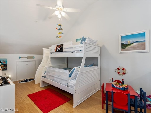 bedroom featuring lofted ceiling and light hardwood / wood-style floors