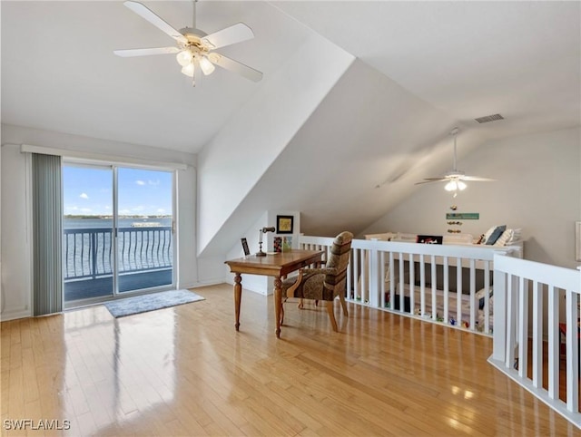 bonus room with a water view, ceiling fan, lofted ceiling, and light hardwood / wood-style floors