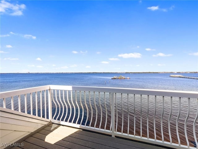 deck with a water view and a beach view